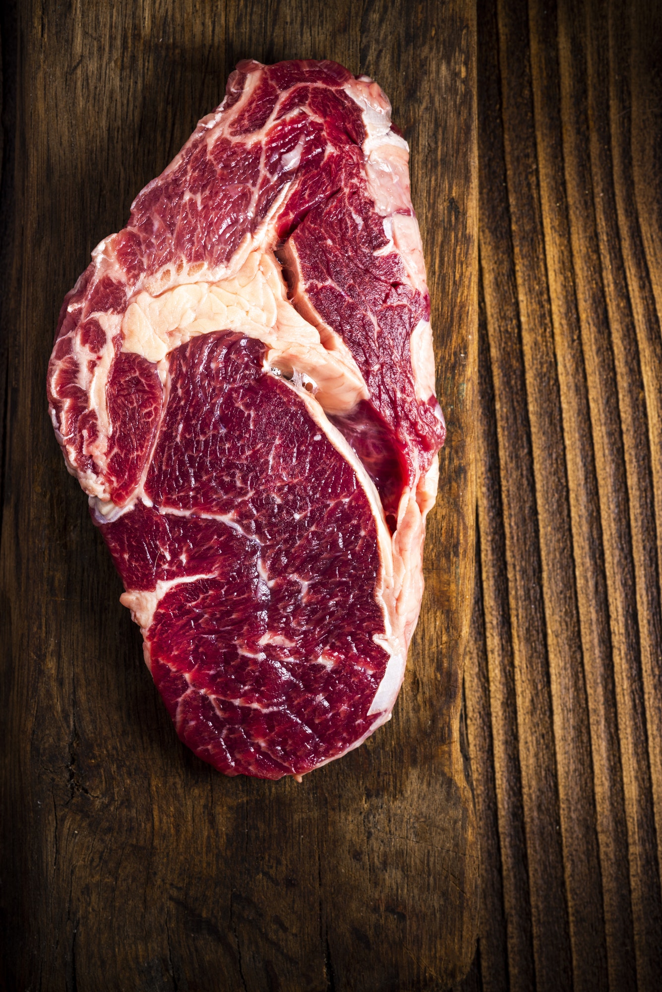 Raw Beef Steak Meat on Wooden Board
