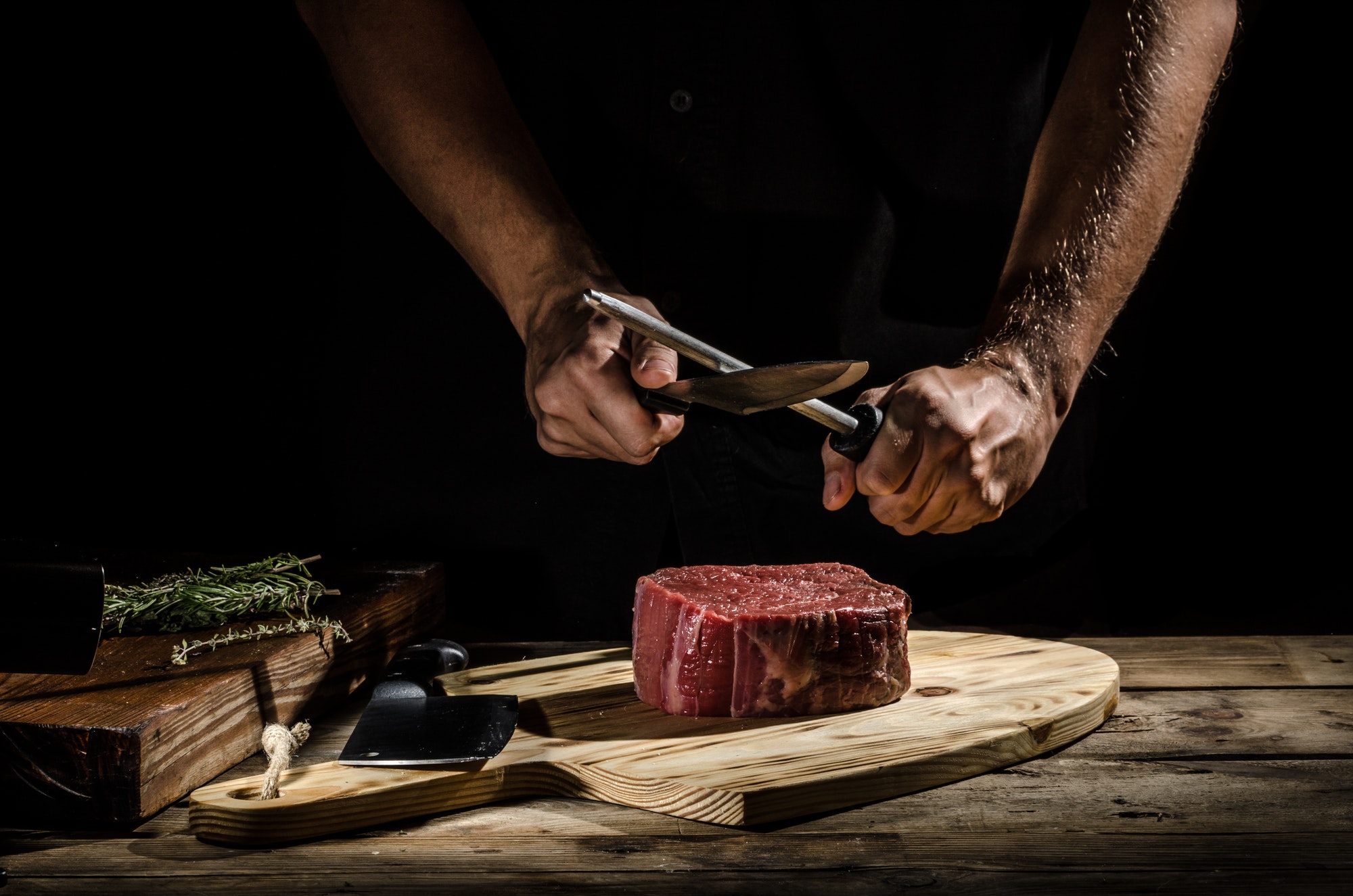 Chef butcher prepare beef steak