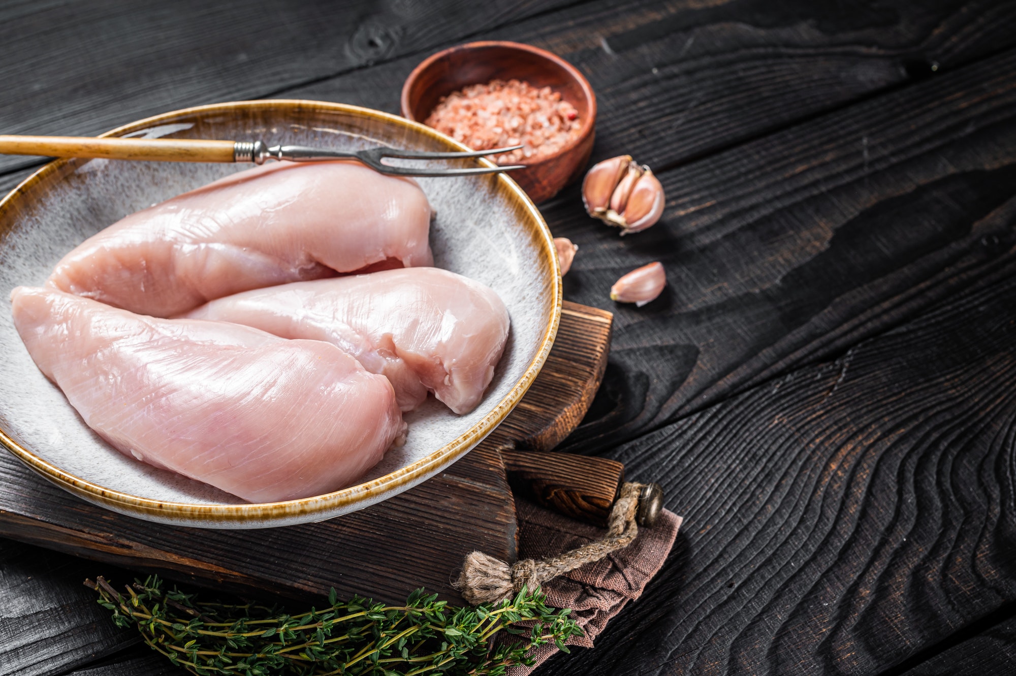 Chicken breast fillet, fresh raw poultry meat on butcher table.
