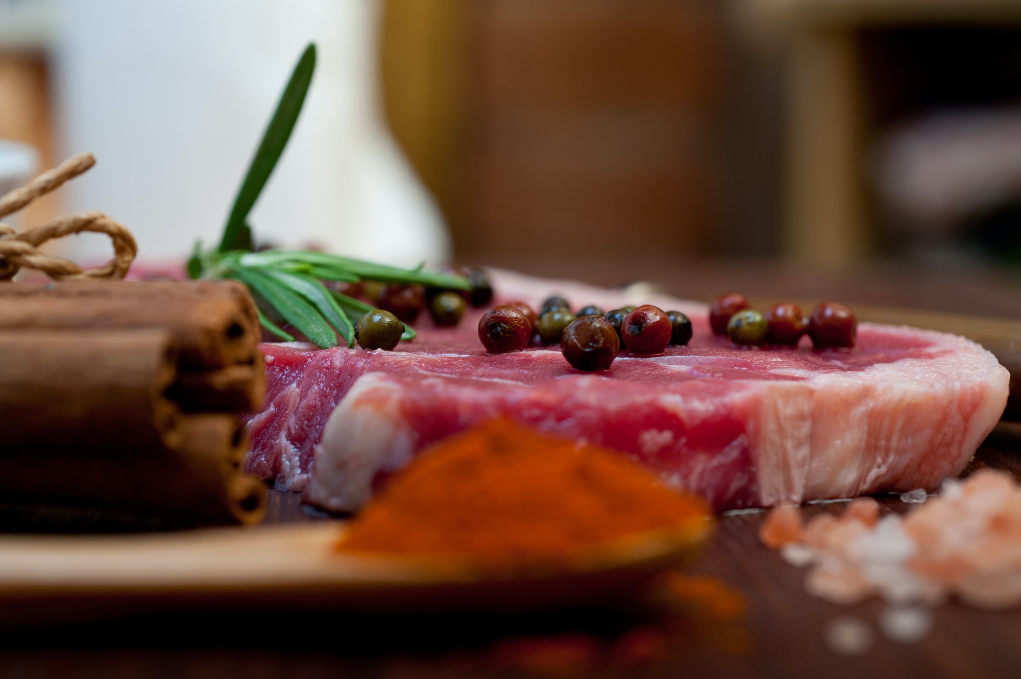 raw uncooked ribeye beef steak butcher selection